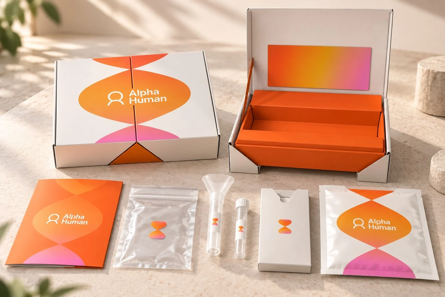 The Alpha Human DIY sample collection kit: the box, opened, with its instruction booklet, collection funnel and tube, specimen bag, card and return pouch.